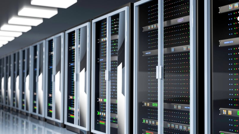 Data center server room interior with multiple data racks.